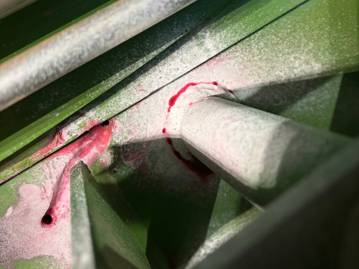 Developer showing a second crack around the base of a pin on a hay baler near Prairie