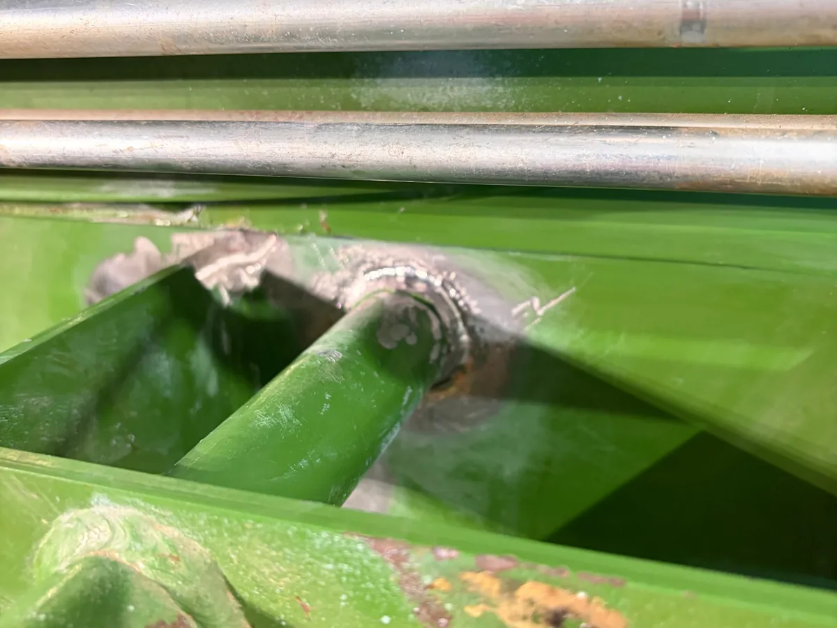 New MIG weld around the base of a pin on a hay baler near Prairie, where the second crack was