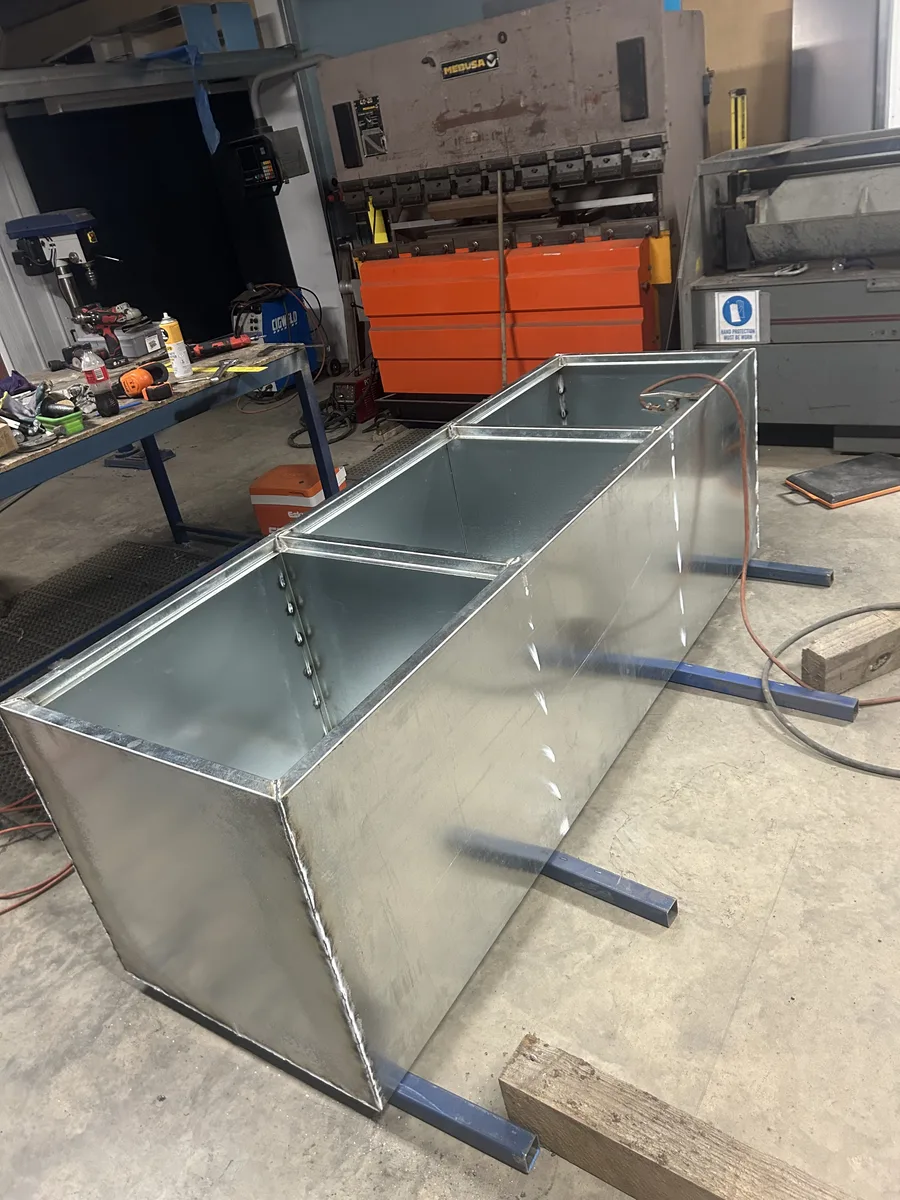 Custom galvanised steel planters being fabricated in Troy's original home workshop