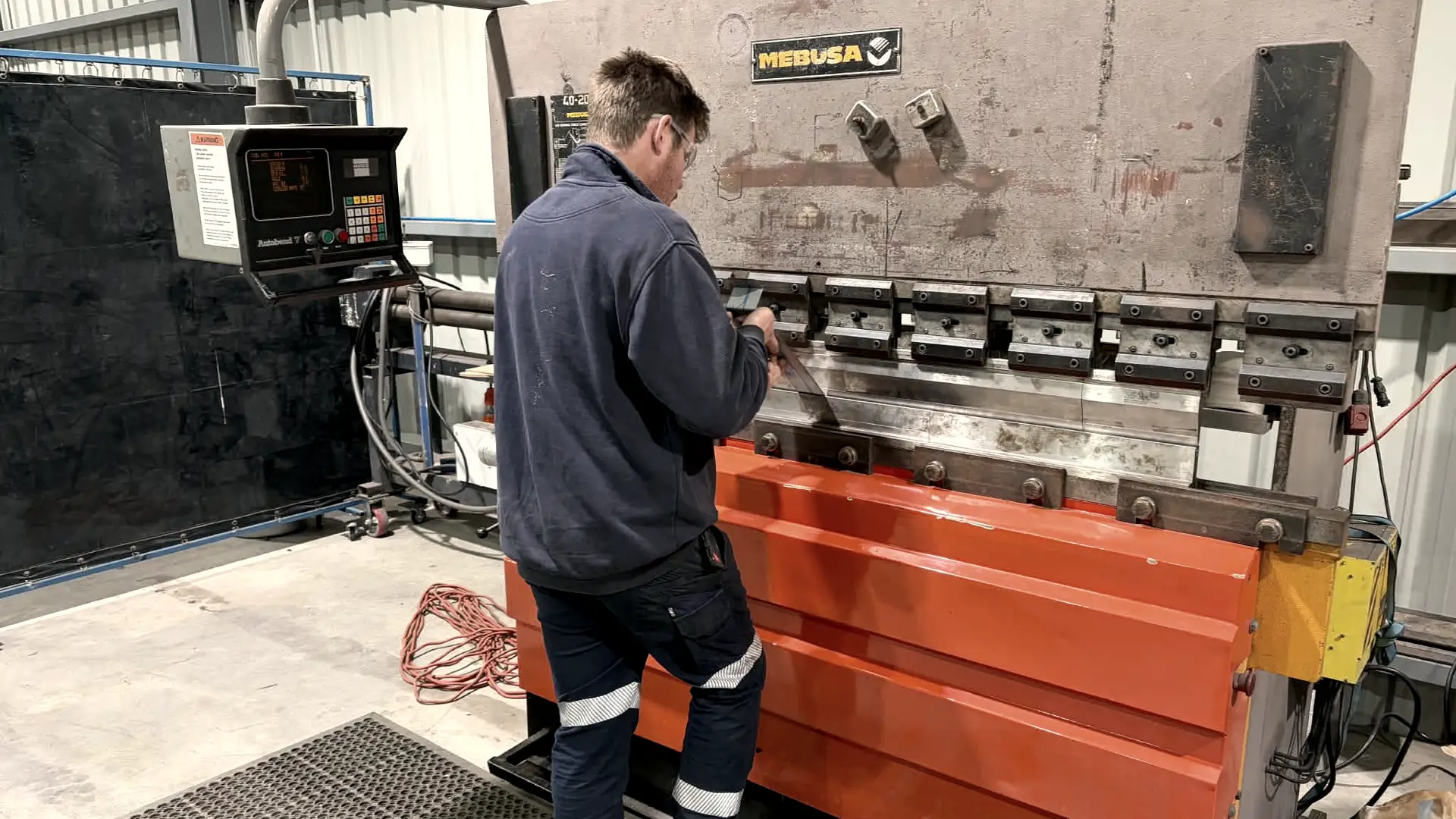 Troy operating the press brake at the Golden Square workshop
